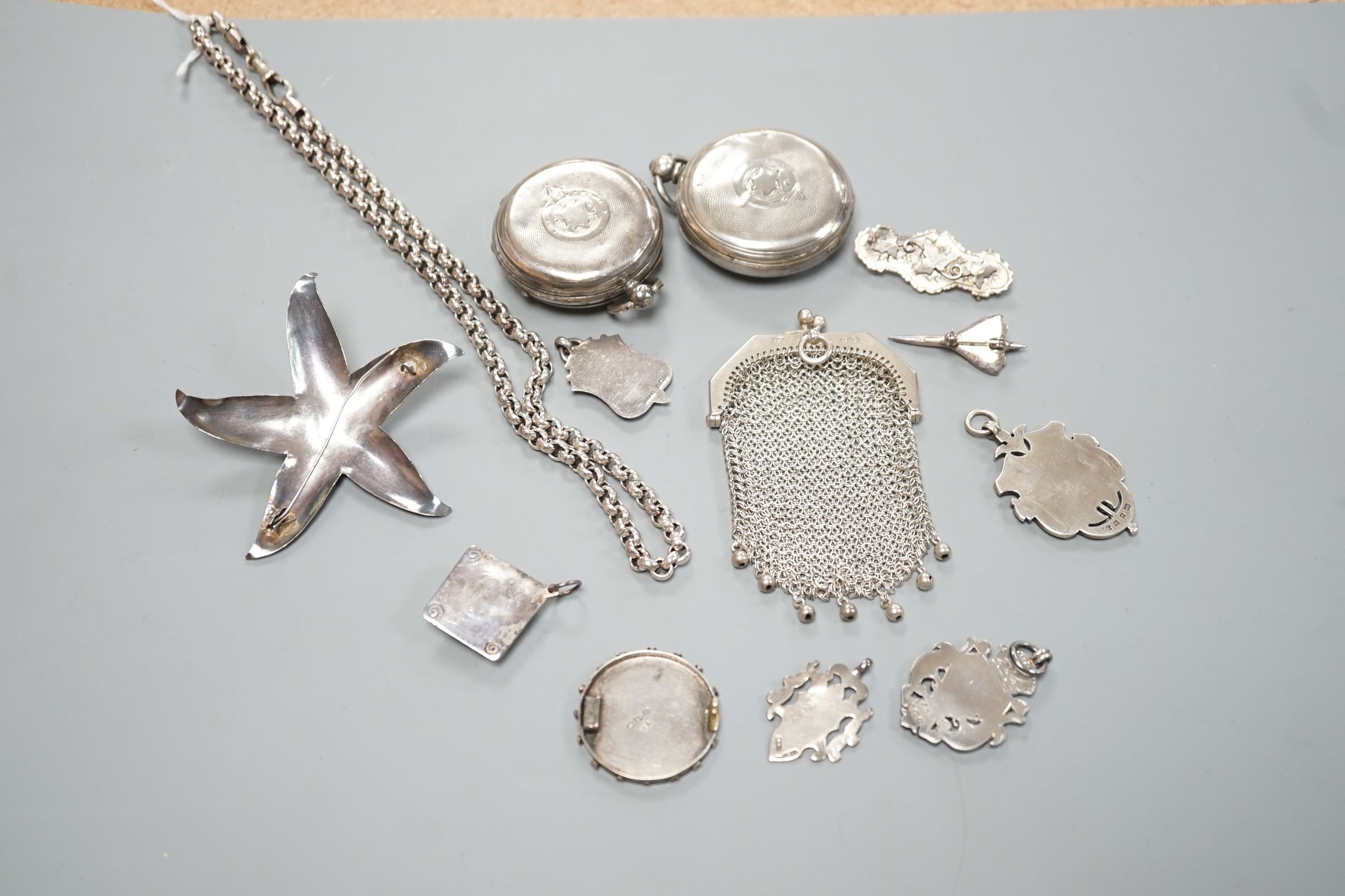 A small group of mainly silver and white metal jewellery including belcher chain, brooches, medallions, evening purse etc. and two silver pocket watch cases.